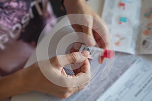 Process of coronavirus testing examination at home, COVID-19 swab collection kit, test tube for taking OP NP patient specimen