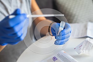 Process of coronavirus testing examination at home, COVID-19 swab collection kit, test tube for taking OP NP patient specimen