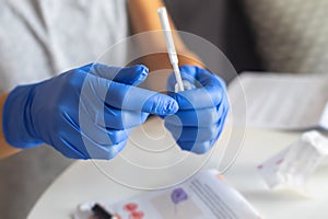 Process of coronavirus testing examination at home, COVID-19 swab collection kit, test tube for taking OP NP patient specimen