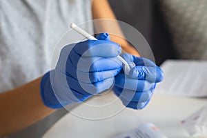 Process of coronavirus testing examination at home, COVID-19 swab collection kit, test tube for taking OP NP patient specimen