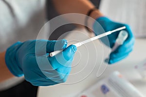 Process of coronavirus testing examination at home, COVID-19 swab collection kit, test tube for taking OP NP patient specimen