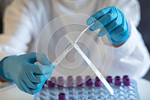 Process of coronavirus testing examination by nurse medic in laboratory lab, COVID-19 swab collection kit, test tube for taking OP