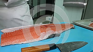 Process of cutting and filleting salmon
