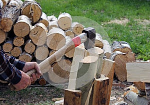 The process of cutting wood with a cleaver