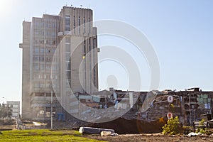 process of destruction of the building due to dilapidation and widening of the road. Destroyed multi-storey building