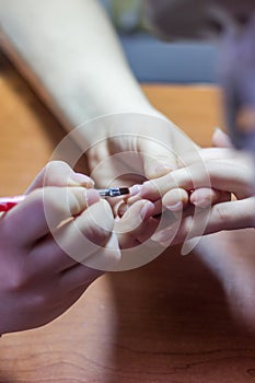 The process of doing a manicure in the spa salon.