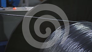 The process of drawing aluminium wire in the factory.