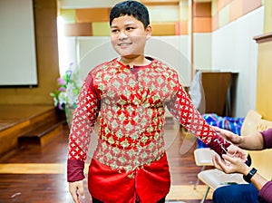 The process of dressing the Thai pantomime for the actors with hand sewing, repairing