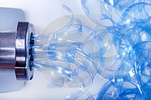 Process drinding plastic bottle. Recycling plastic, polymers in the machine.