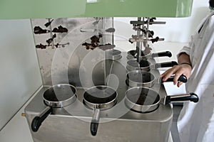 Process of elaboration of olive oil in a laboratory photo