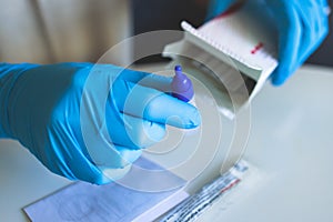 Process of express fast coronavirus covid Antigen AG PCR testing examination at home, COVID-19 swab collection kit, test tube for