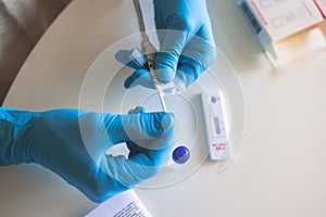 Process of express fast coronavirus covid Antigen AG PCR testing examination at home, COVID-19 swab collection kit, test tube for