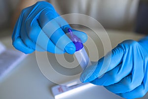 Process of express fast coronavirus covid Antigen AG PCR testing examination at home, COVID-19 swab collection kit, test tube for