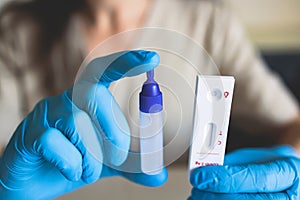 Process of express fast coronavirus covid Antigen AG PCR testing examination at home, COVID-19 swab collection kit, test tube for