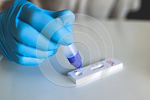 Process of express fast coronavirus covid Antigen AG PCR testing examination at home, COVID-19 swab collection kit, test tube for