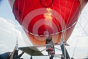 Process of filling air balloon with hot air and fire