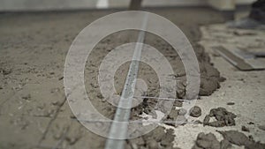 The process of filling and leveling floors. Construction worker Concrete pouring during commercial concreting floors of building