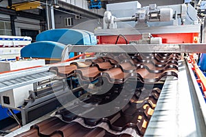 Process of forming Metal Tile close up in metalforming machine