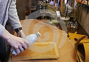The process of gluing the details of leather products master of leather