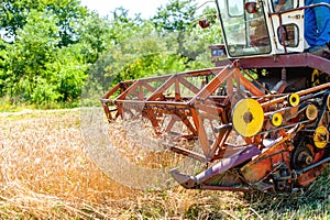Process of harvesting with combine, gathering mature grain crops