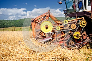 Process of harvesting with combine, gathering mature grain crops