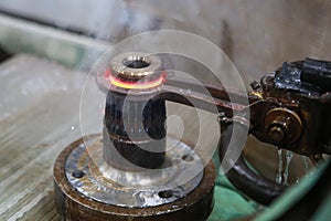 Process of heating and cooling metal. Hardening of steel part in production