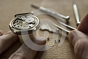 Process of installing a part on a mechanical watch, watch repair