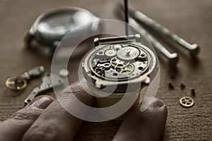 Process of installing a part on a mechanical watch, watch repair