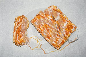 The process of knitting the cap with a pattern of the riffle