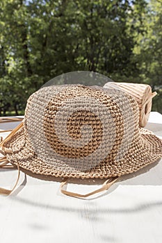 The process of knitting a raffia hat,