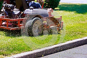 process of lawn mowing, concept of mowing the lawn, lawnmower cutting grass with gardening tools