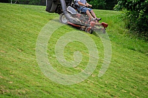 process of lawn mowing season sunny day lawn mowing in the garden