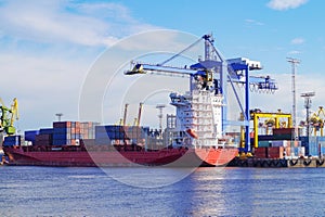 The process of loading containers onto a cargo ship container ship. Port of St. Petersburg