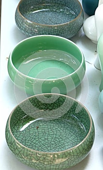 Porcelain pots in rows photo