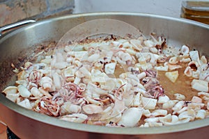 in the process of making a black rice with squids