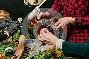 Process making Christmas wreath pine needles gluing