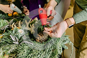 Process making Christmas wreath pine needles gluing