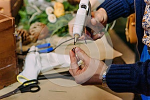 Process making Christmas wreath pine needles gluing