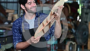 The process of making a classical guitar, Craftsman making the right shape of a brace guitar