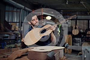 The process of making a classical guitar, Luthier checking guitar
