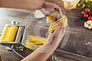 Process of making cooking homemade pasta. Woman make fresh italian traditional pasta