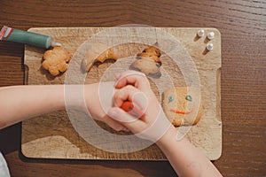 Process of making and decorating a traditional homemade Christmas gingerbread cookie.