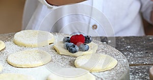 The process of making homemade dumplings with women and child hands. Pierogi or varenyki make