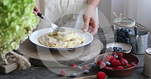 The process of making homemade dumplings with women and child hands. Pierogi or varenyki make