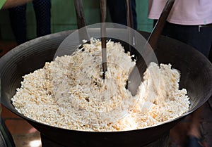Process of making Marshmallow Crispy puffed Rice cake in Mekong delta, southern Vietnam, motion blur