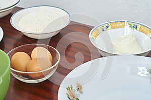 The process of making pie dough by hand. Baking cake in a kitchen dough recipe ingredients eggs, flour, milk, butter, sugar on