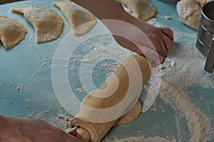 Process of making qutab or chebureki, minced meat and onion in dough.