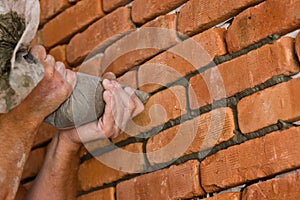 Process of making a red brick wall, home renovation