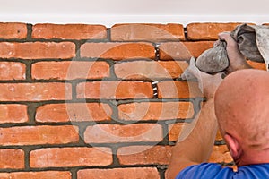 Process of making a red brick wall, home renovation