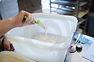 The process of making wheat bread. Sourdough is added to the mixing container.